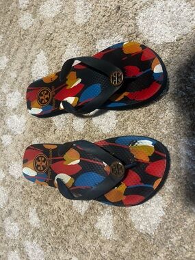 Tory Burch women’s Black Multi-Color Logo Flip Flops